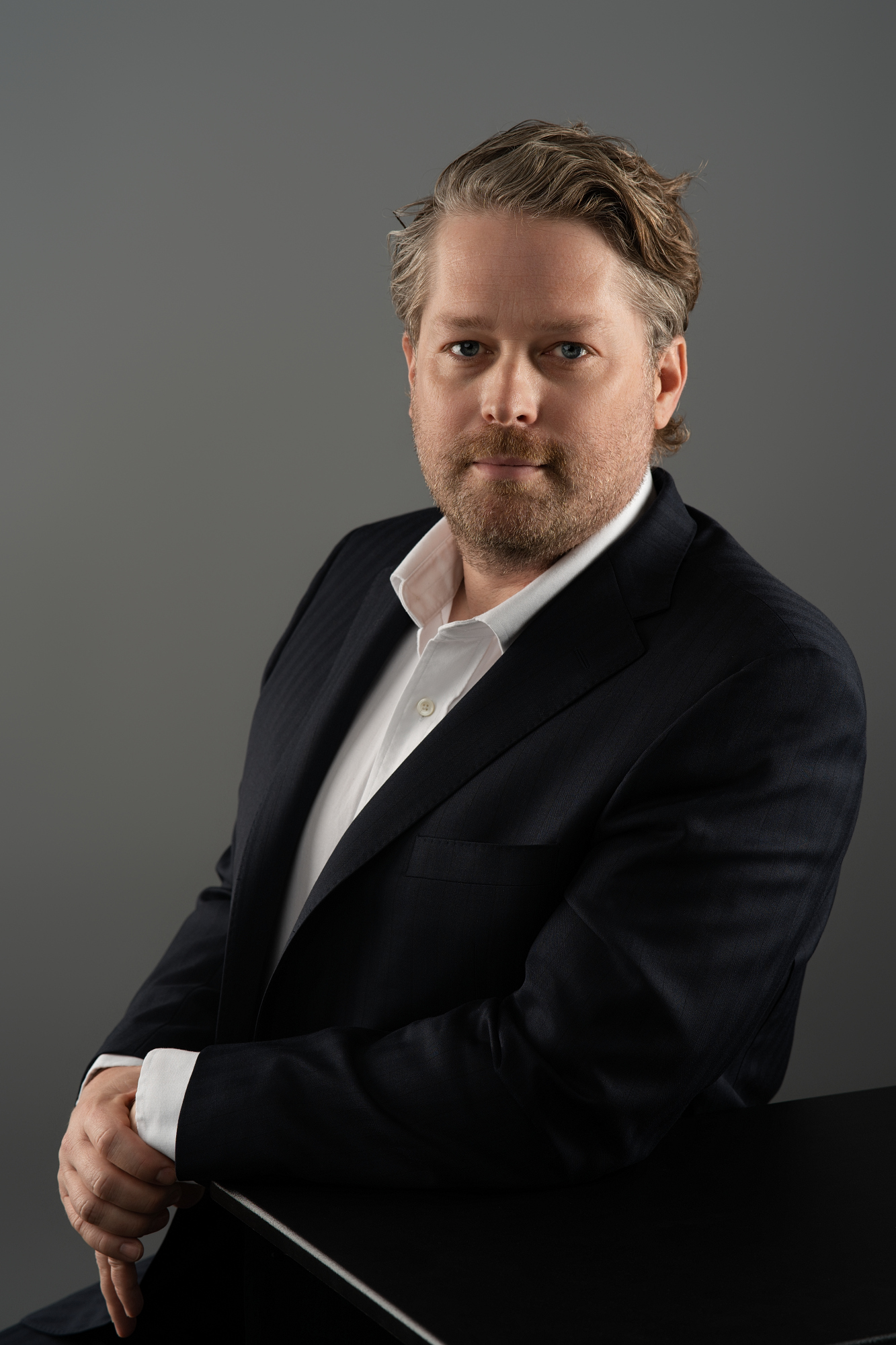 Professional man in dark suit.