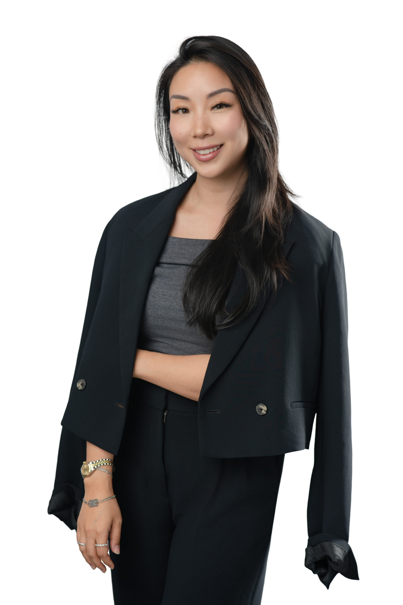 Anita Yeh, Director of Retail Operations at Monos, professional corporate headshot wearing a black blazer on a white background
