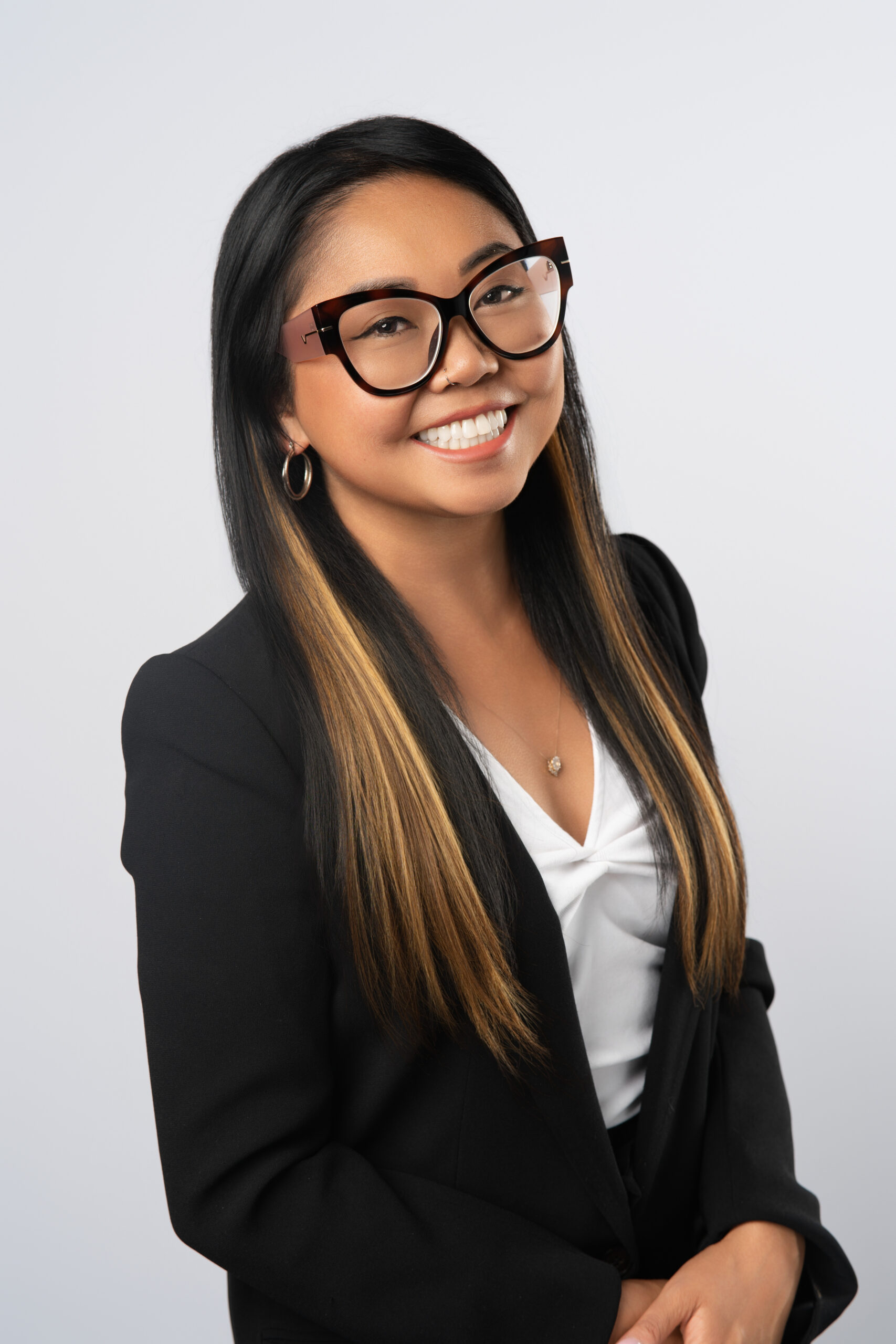 Bernadette Lagrito, posing with hands clasped for a Vancouver Professional Headshot.