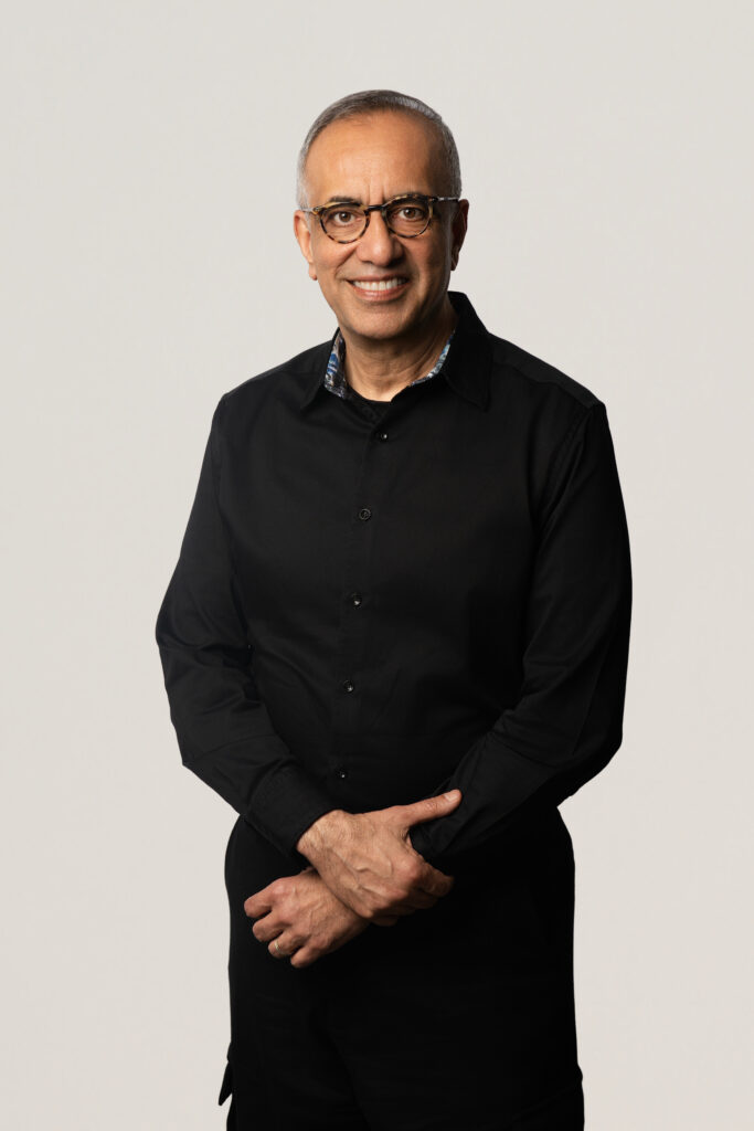 Vicky Bindra, CEO of Truilioo for a headshot session while standing with right had on left wrist.